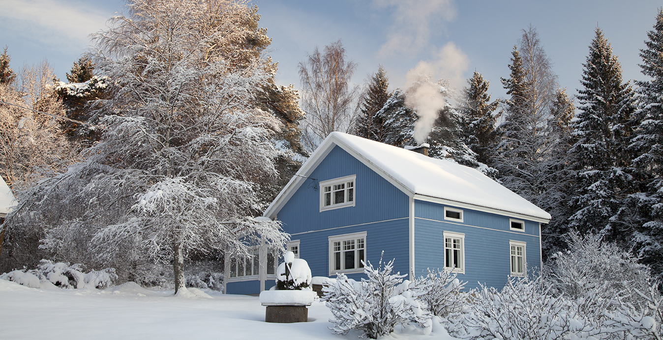 image of a home during a winter snow fall